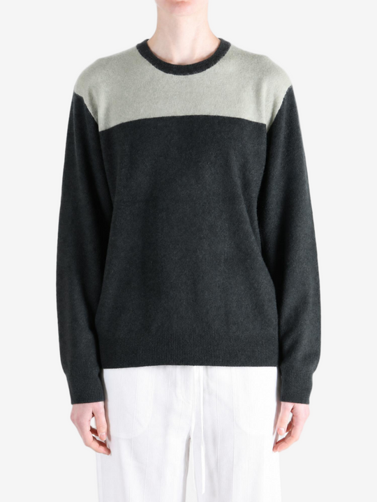 Grey hoodie worn by a person, showing the hoodie fit