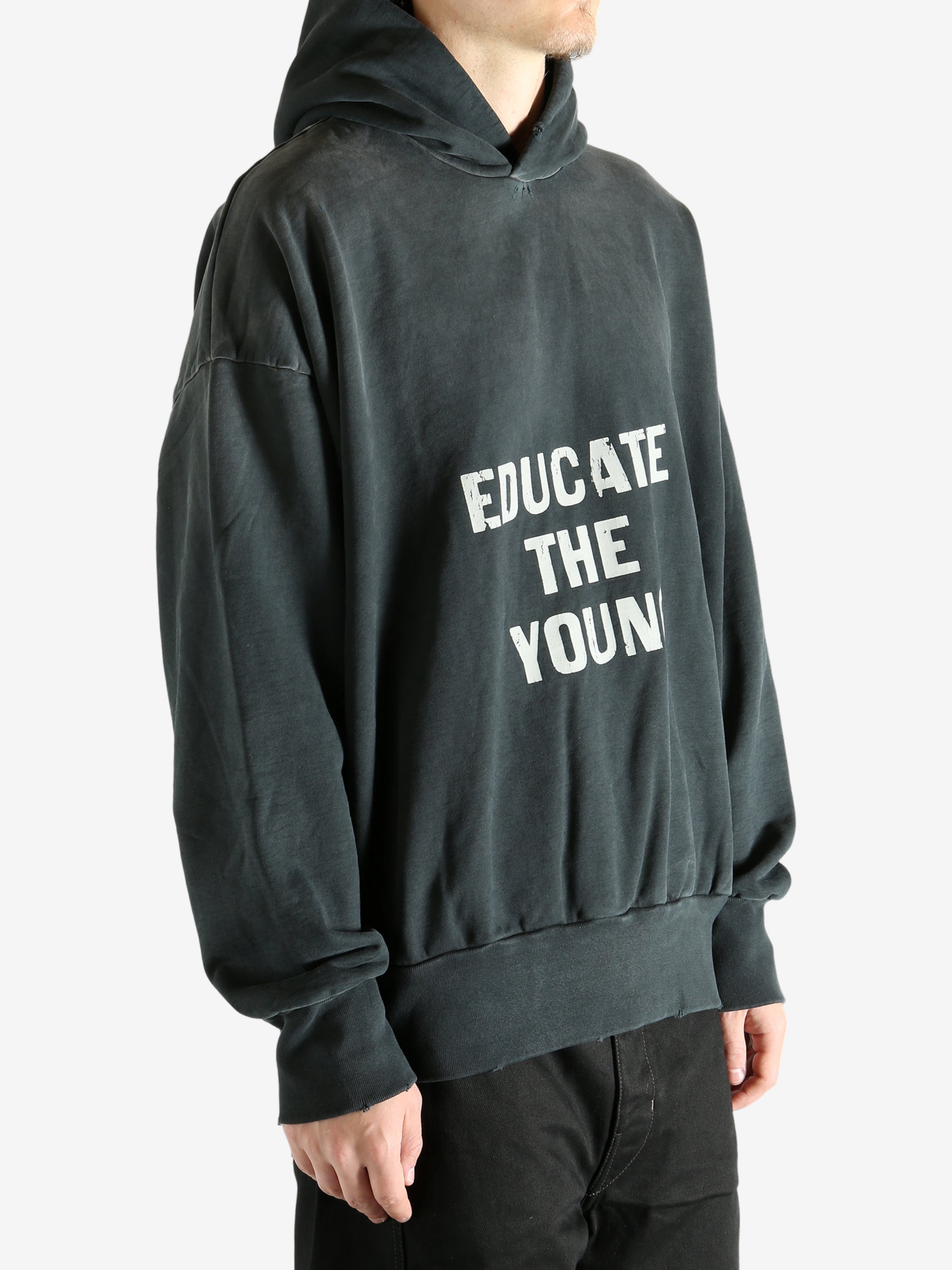 Black hoodie worn by a person, showing the hoodie's fit