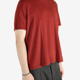 Red t-shirt worn by a person, showing the shirt's fit