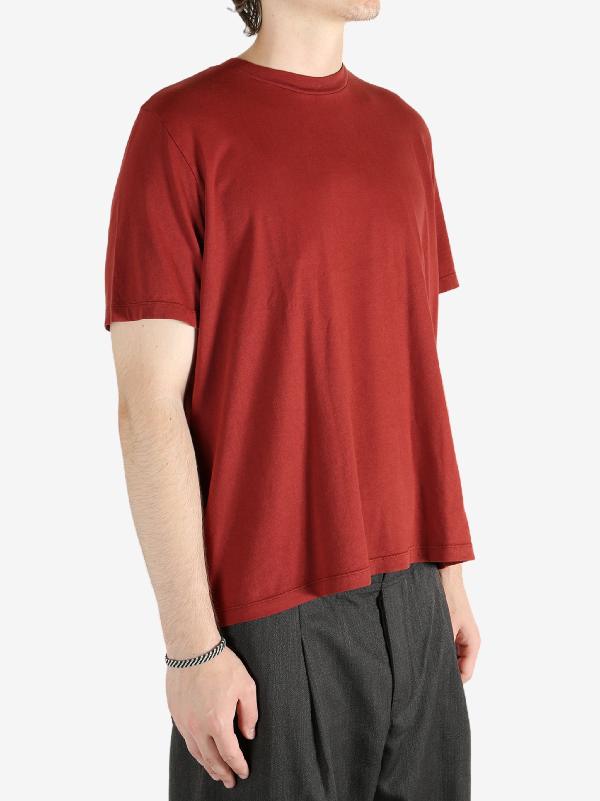 Red t-shirt worn by a person, showing the shirt's fit