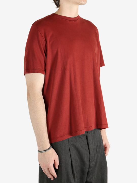 Red t-shirt worn by a person, showing the shirt's fit