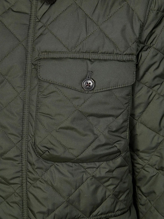 Close up of Green jacket, showing texture of the 100% polyester/ 100% cotton fabric