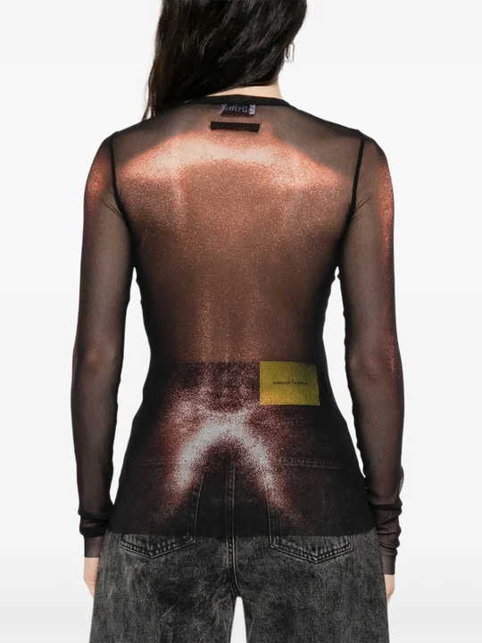 Black top worn by a person, showing the top's fit