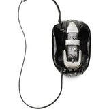 Close up of black bags, showing texture of the leather fabric