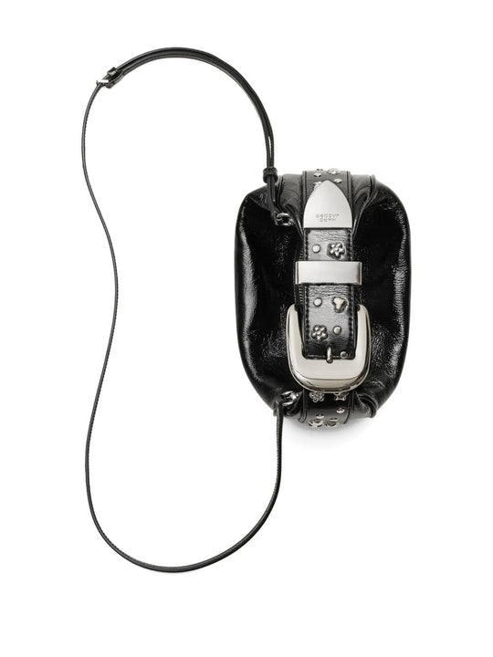 Close up of black bags, showing texture of the leather fabric