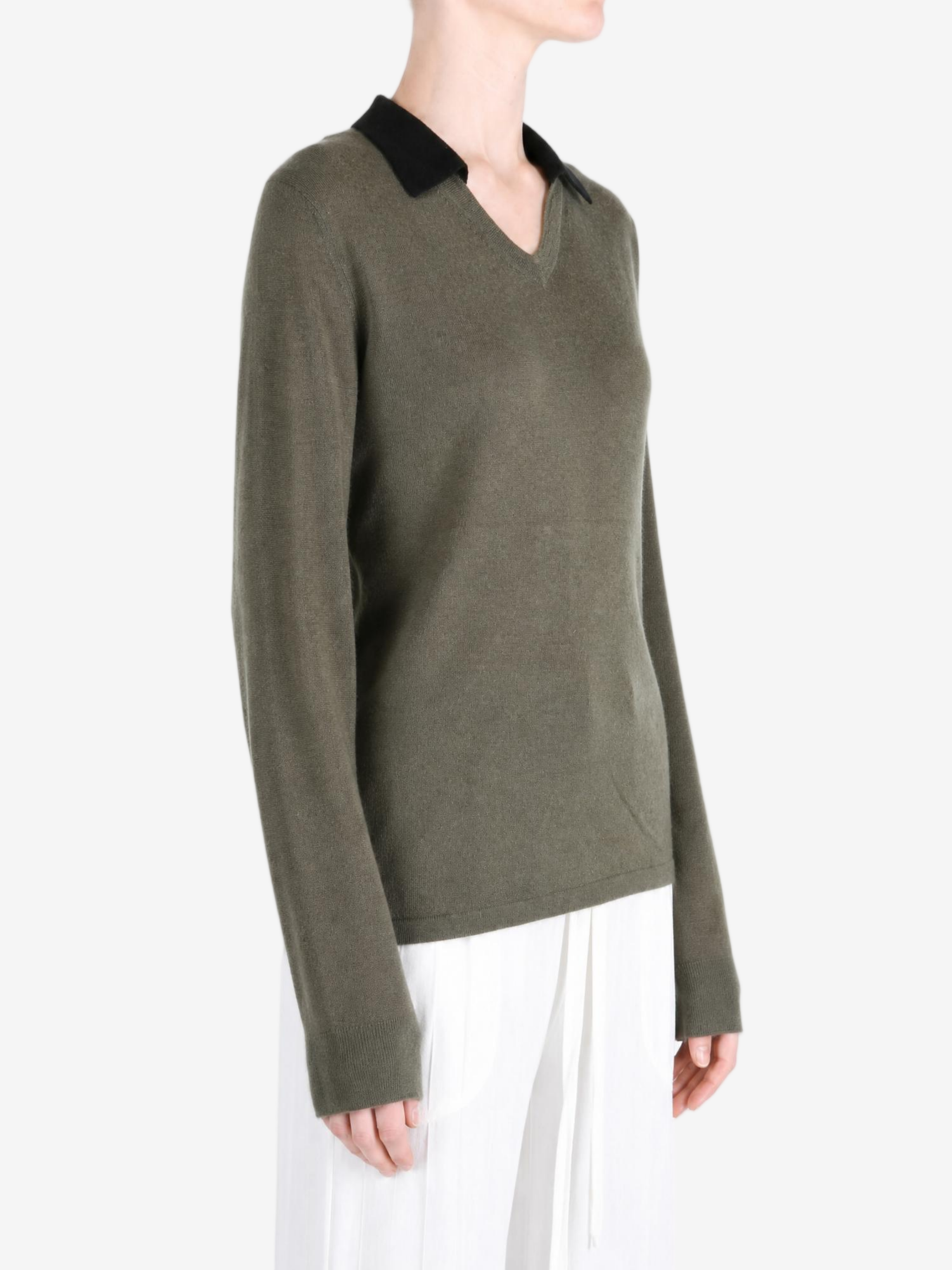 Green t-shirt worn by a person, showing the t-shirt fit