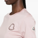 Pink t-shirt worn by a person, showing the t-shirt fit