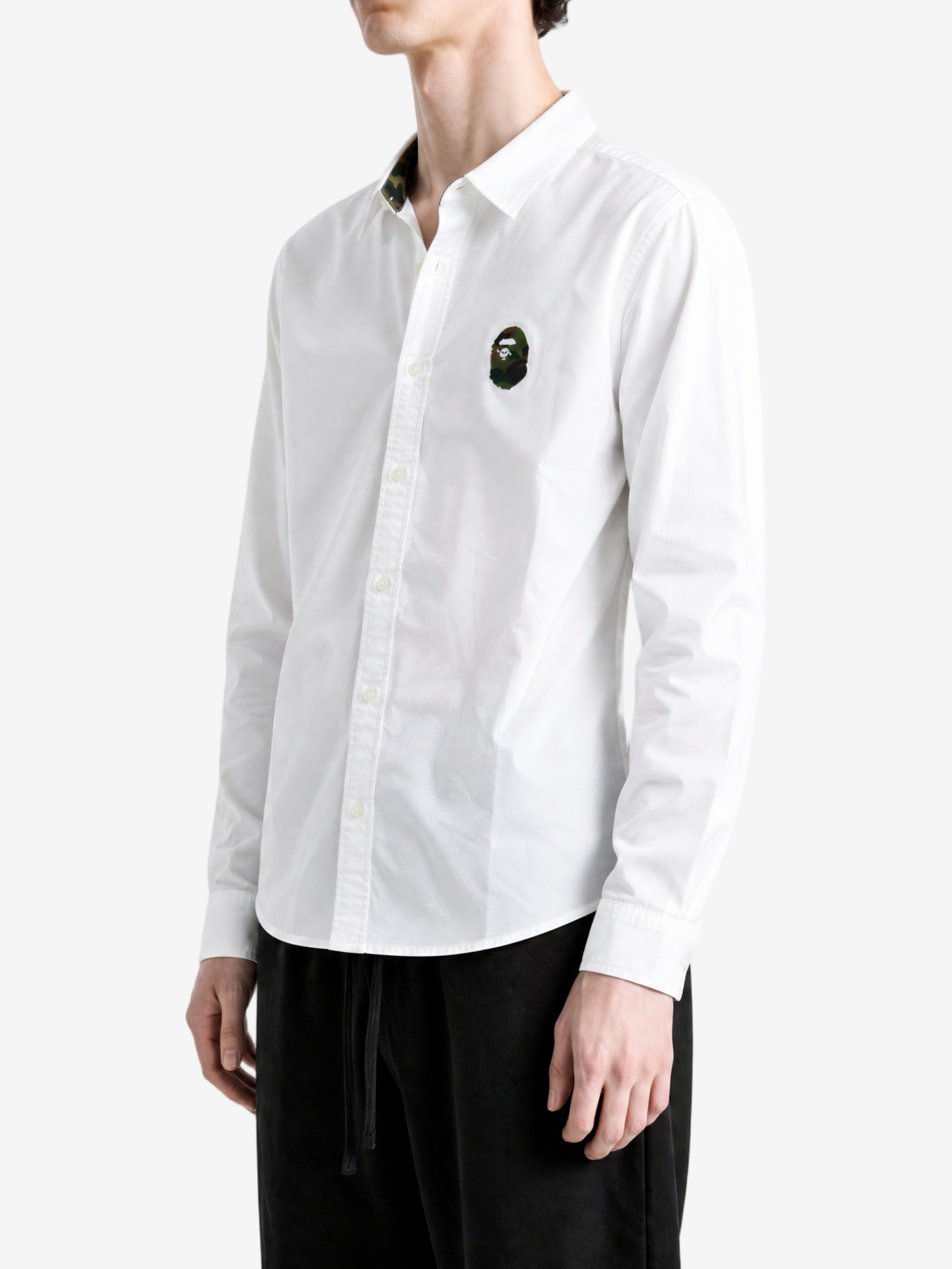 White shirt worn by a person, showing the shirt fit