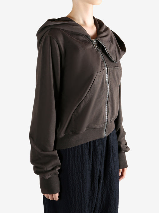 Brown hoodie worn by a person, showing the hoodie's fit