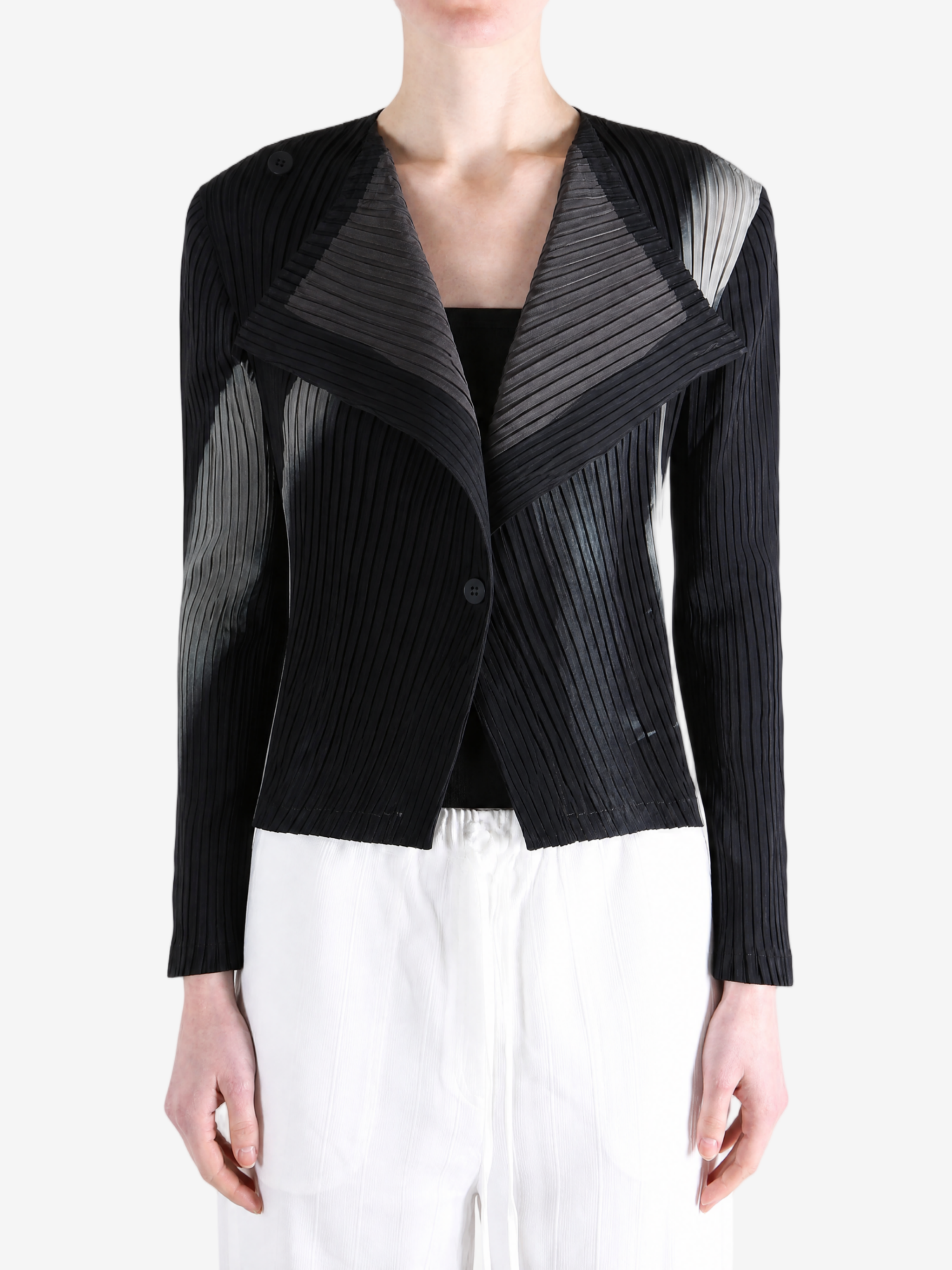 Black knitwear worn by a person, showing the knitwear fit