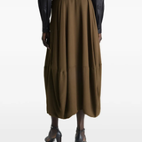 Brown skirt worn by a person, showing the skirt's fit