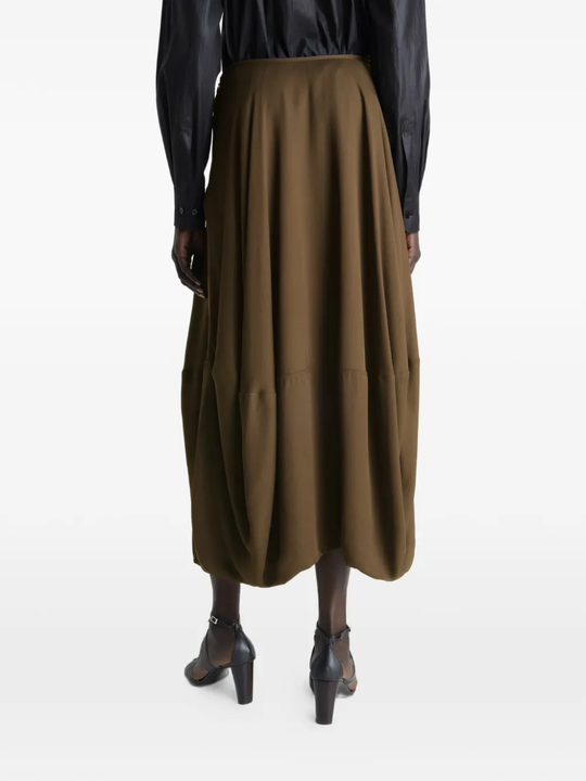 Brown skirt worn by a person, showing the skirt's fit