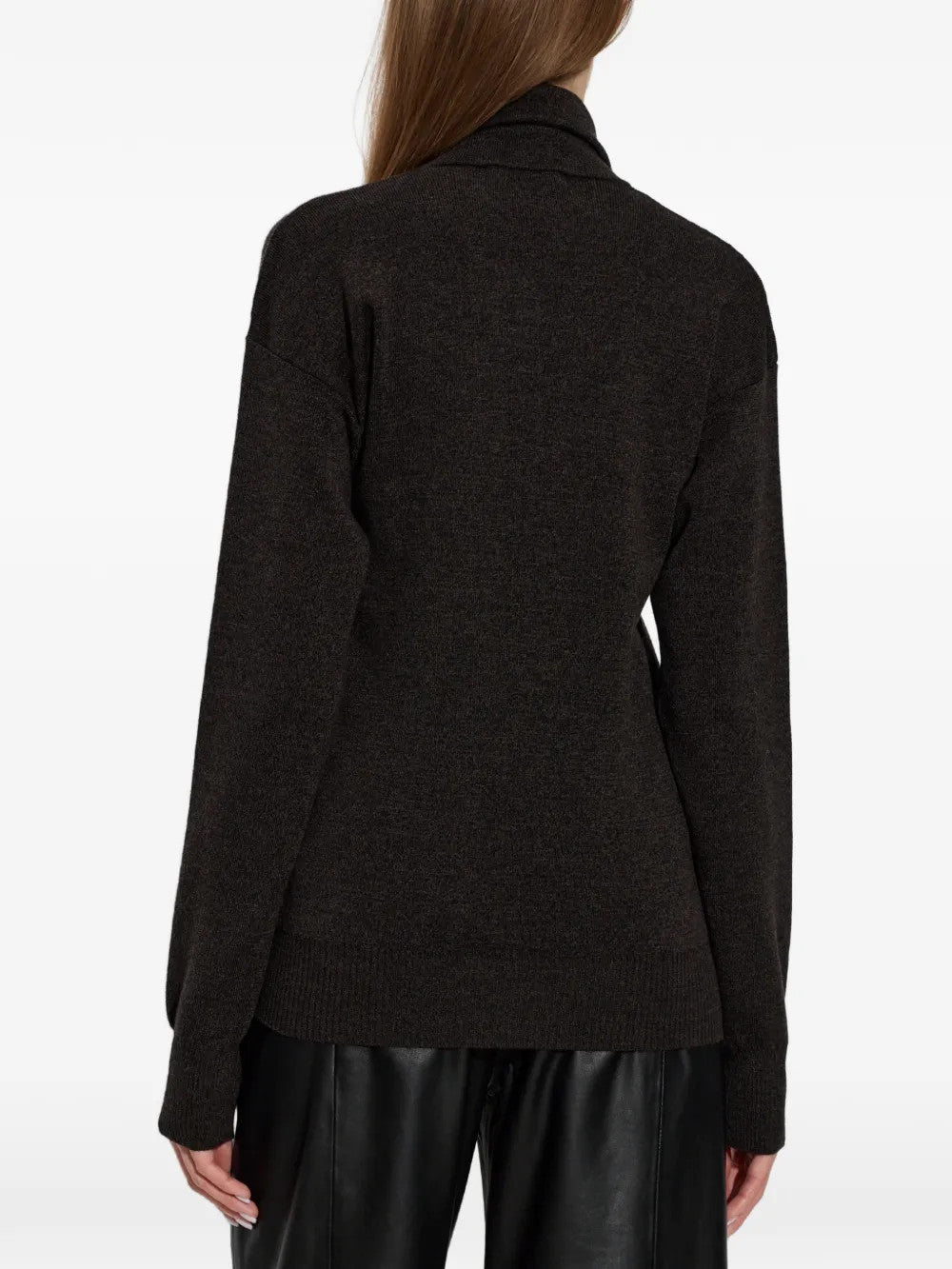 Black top worn by a person, showing the top fit