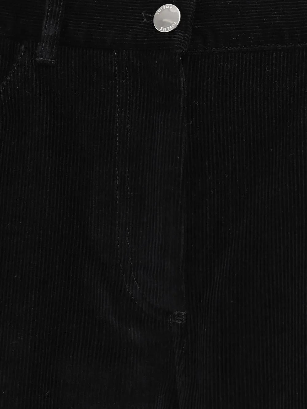 Close up of black pants, showing texture of the cotton fabric