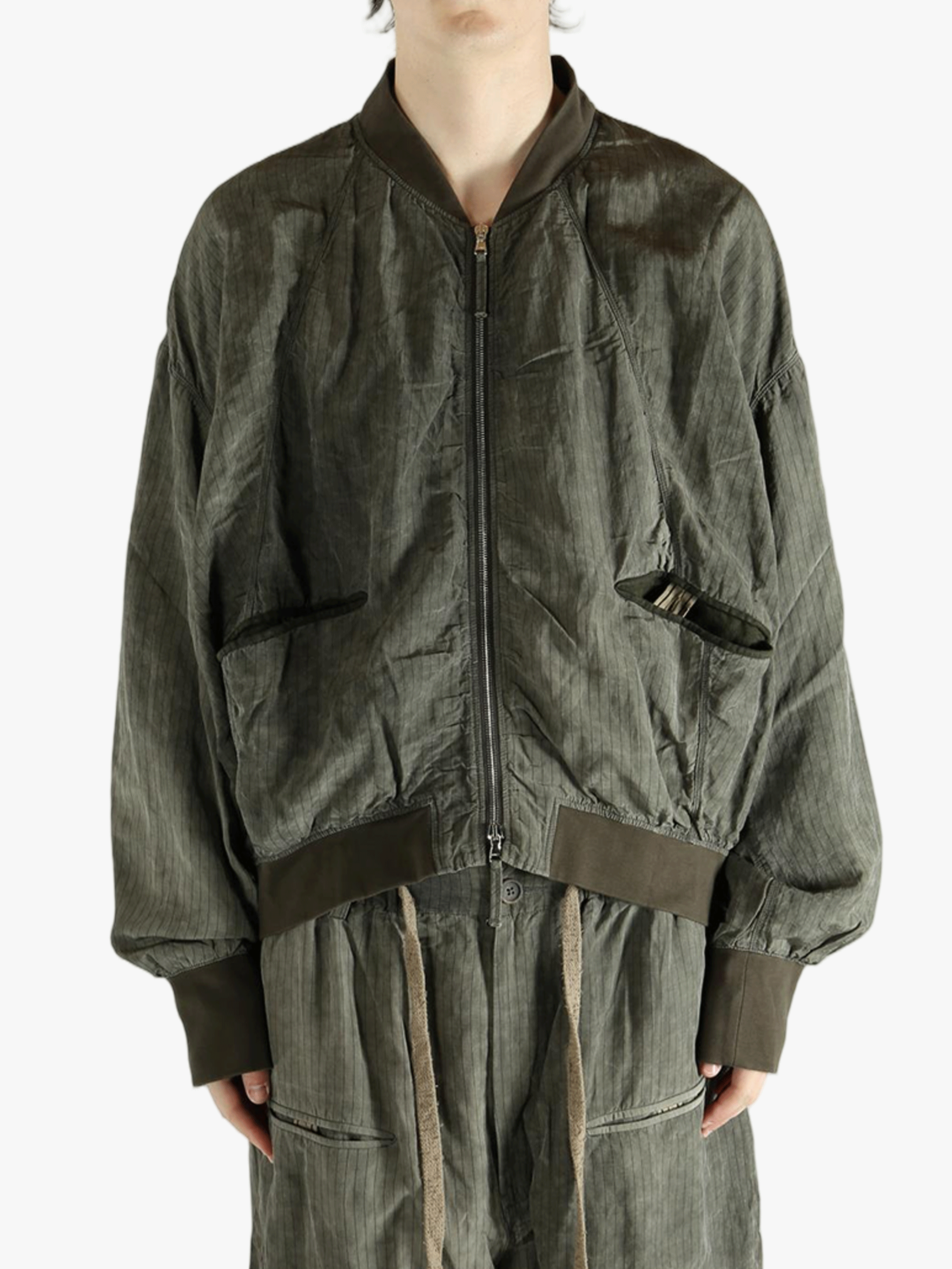 Green jackets worn by a person, showing the jackets fit