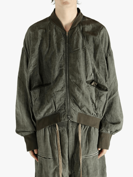 Green jackets worn by a person, showing the jackets fit