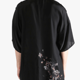 Black jacket worn by a person, showing the jacket's fit