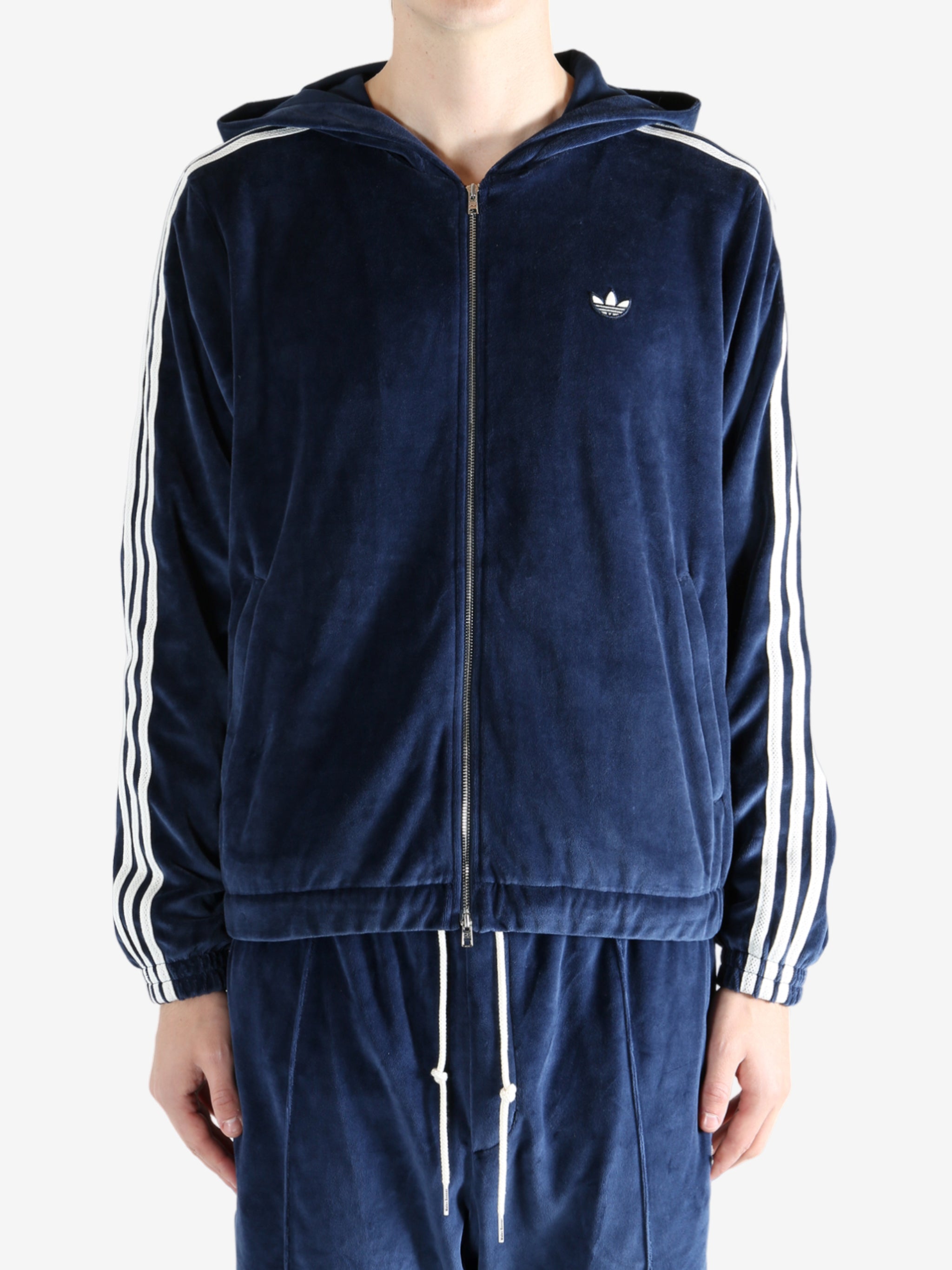 Navy hoodie worn by a person, showing the hoodie's fit