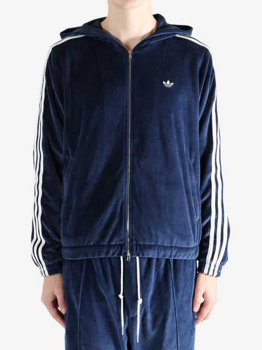 Navy hoodie worn by a person, showing the hoodie's fit