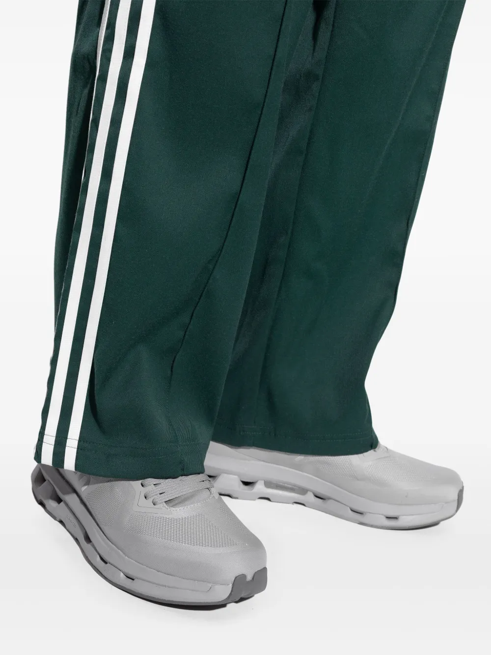 close up of white sneakers, showing texture of the rubber fabric