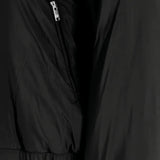 Close up of Black jacket, showing texture of the 100% polyester fabric