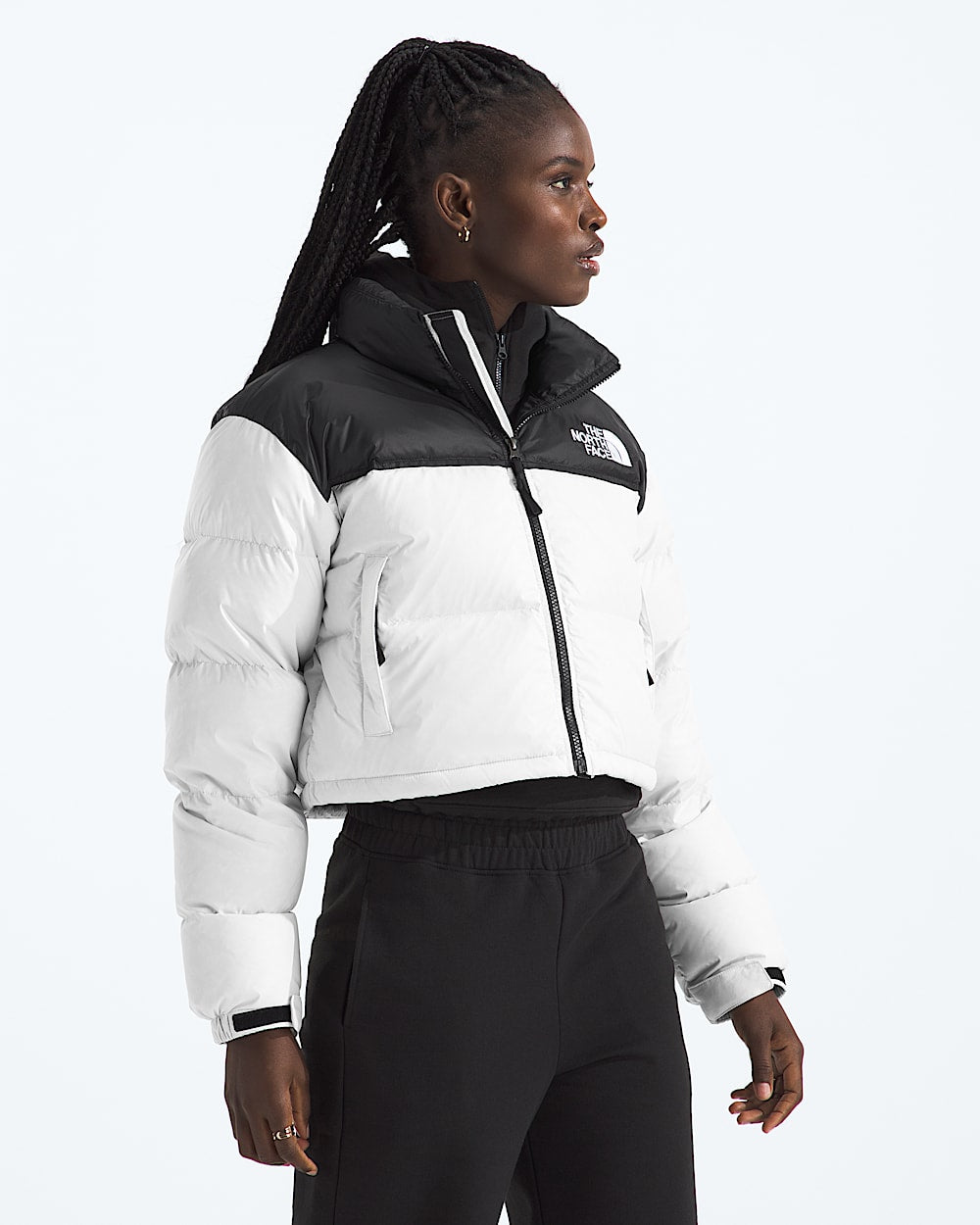 White jacket worn by a person, showing the jacket fit