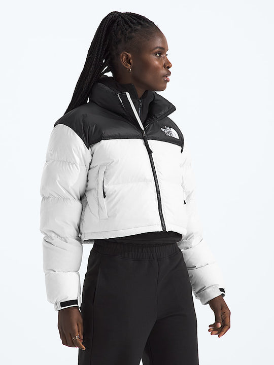 White jacket worn by a person, showing the jacket fit
