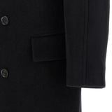 Close up of black jackets, showing texture of the merino fabric