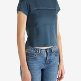 Blue t-shirt worn by a person, showing the shirt's fit