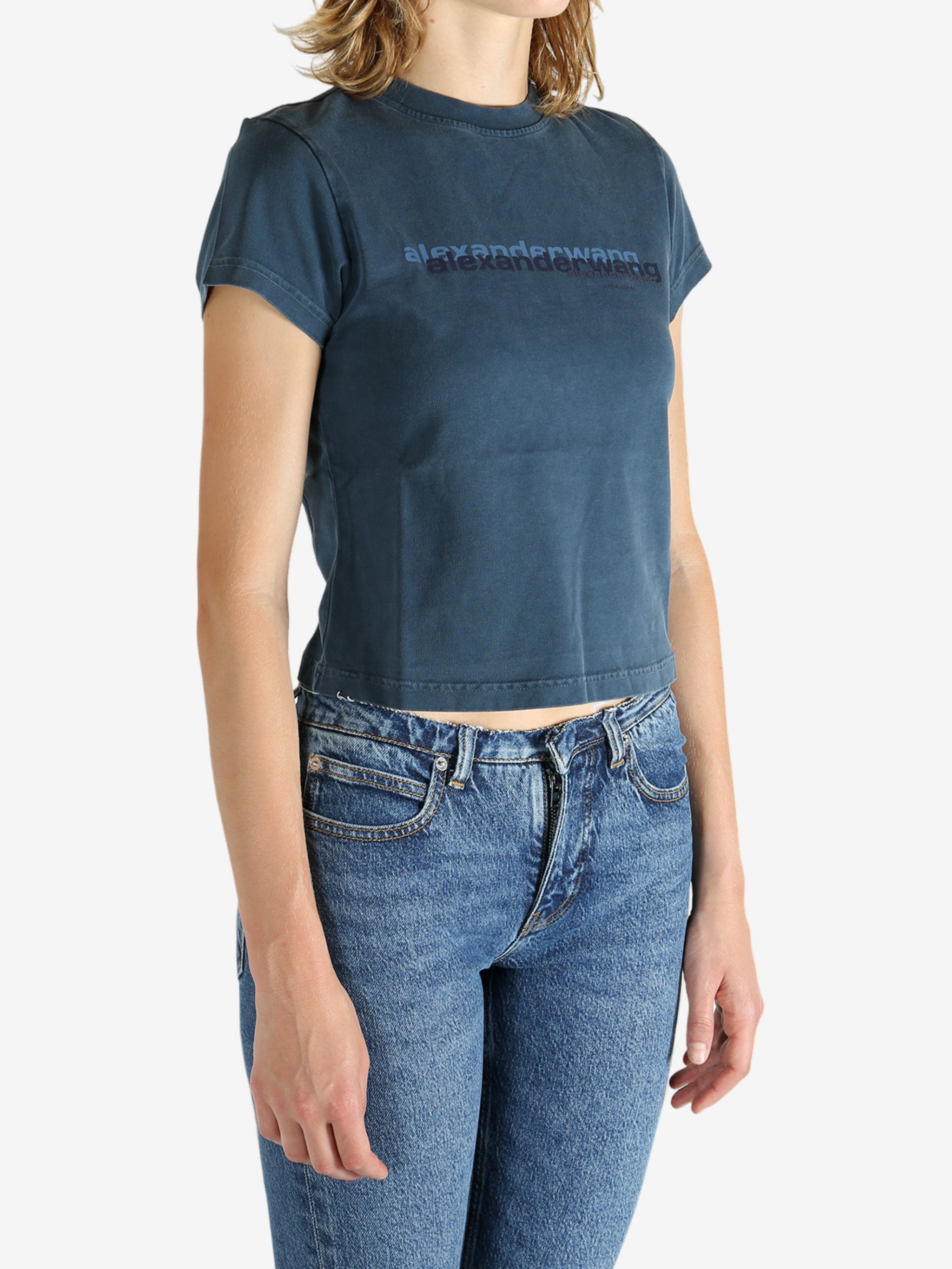 Blue t-shirt worn by a person, showing the shirt's fit