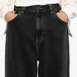 Close up of blue pants, showing texture of the cotton fabric