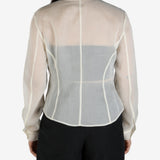 White shirt worn by a person, showing the shirt's fit
