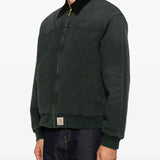 Green jacket worn by a person, showing the jacket fit