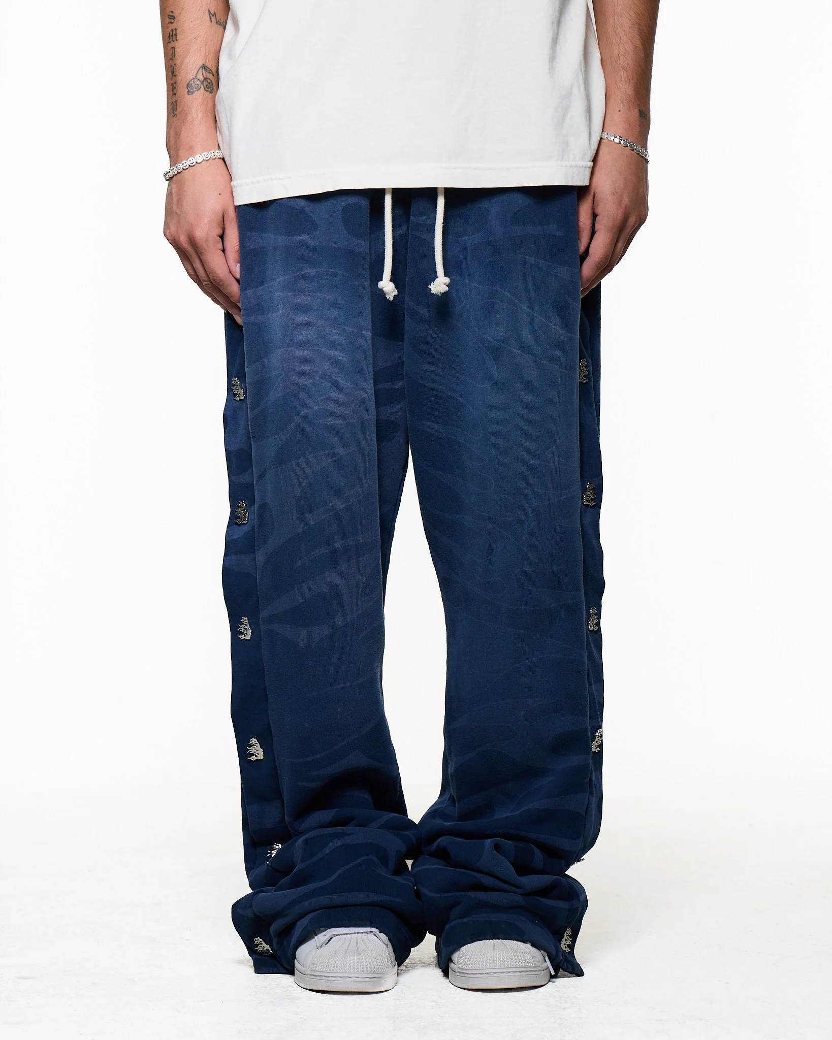 Black pants worn by a person, showing the pants fit