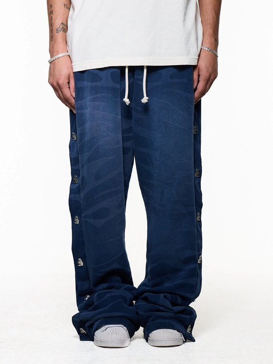Black pants worn by a person, showing the pants fit