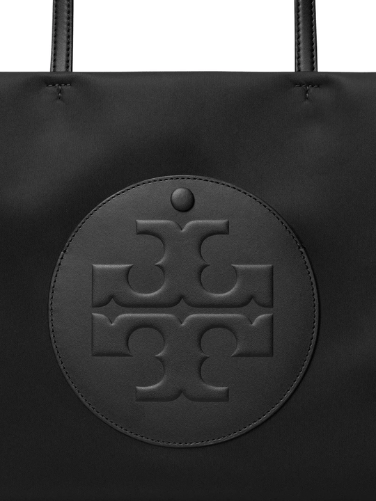 Close up of black tote bag,showing texture of the nylon fabric.