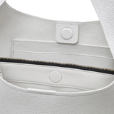 Close up of the white bag, showing texture of the leather fabric