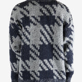 Blue sweater worn by a person, showing the sweater fit