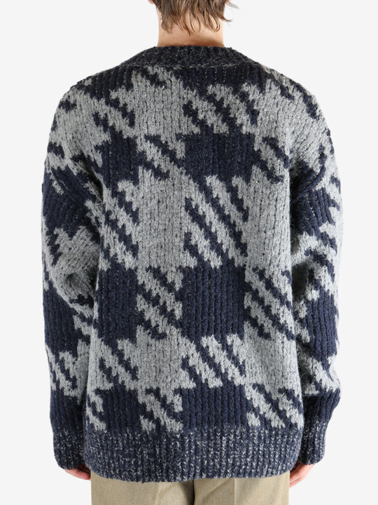 Blue sweater worn by a person, showing the sweater fit