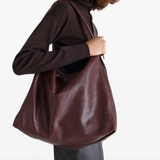 Brown bag worn by a person, showing the bag's fit