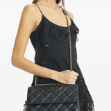 Black bag worn by a person, showing the bag's fit