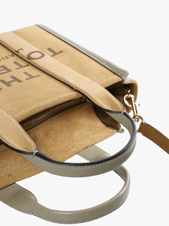 Close up of the brown bag, showing texture of the leather fabric