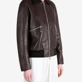 Brown jacket worn by a person, showing the jacket fit