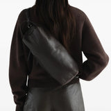 Brown bag worn by a person, showing the bag fit