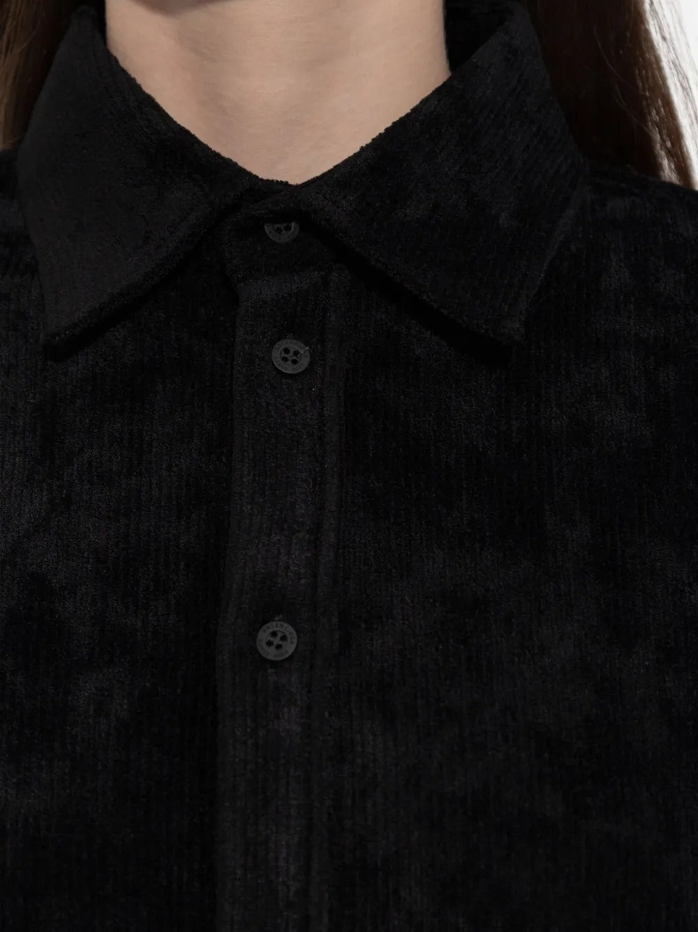 Close up of black shirt, showing texture of the viscose fabric