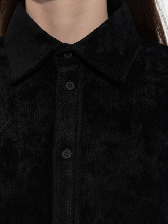 Close up of black shirt, showing texture of the viscose fabric