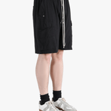 Black shorts worn by a person, showing the shorts fit