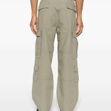 Green pants worn by a person, showing the pants's fit