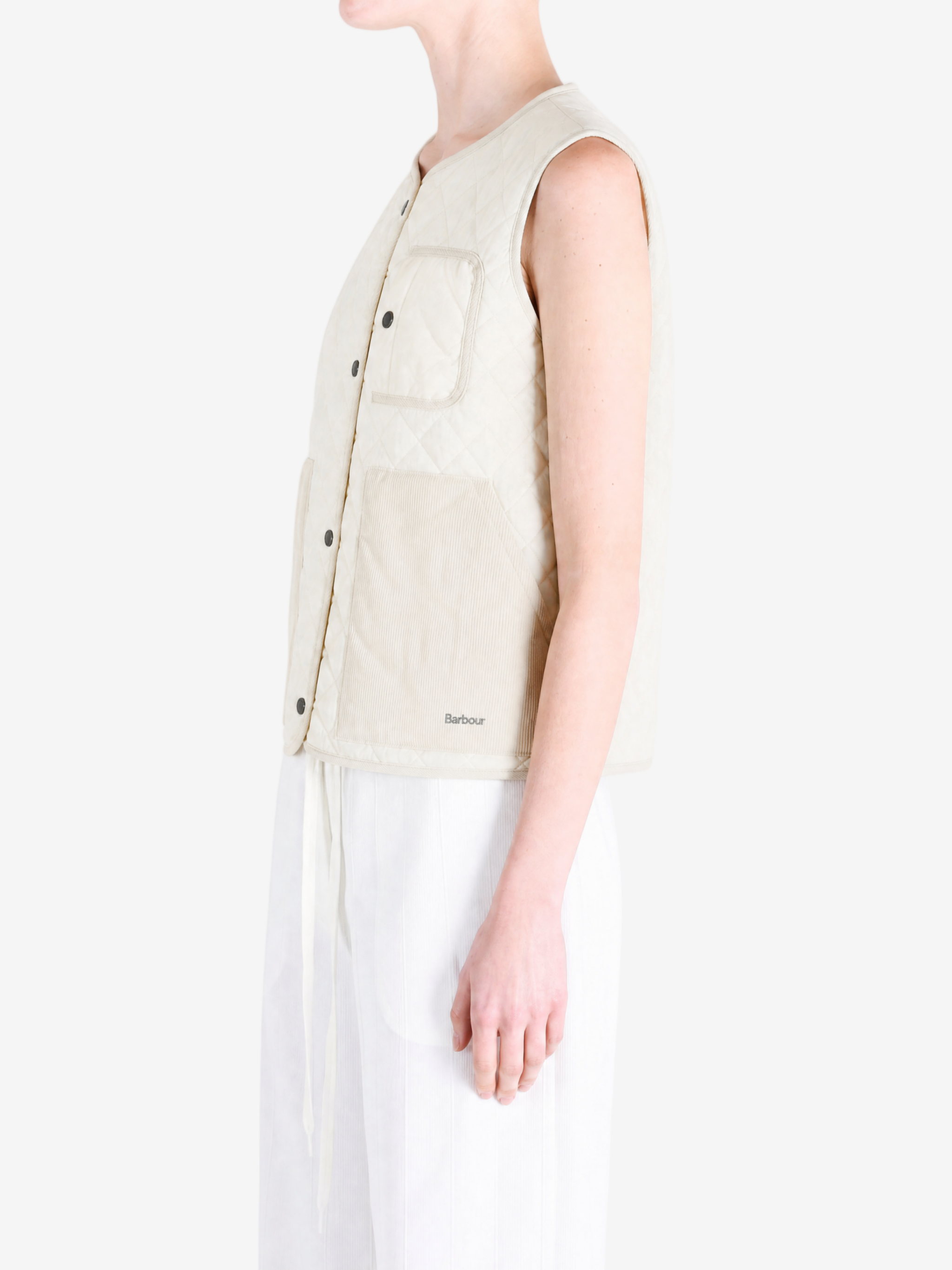 Tan top worn by a person, showing the top fit
