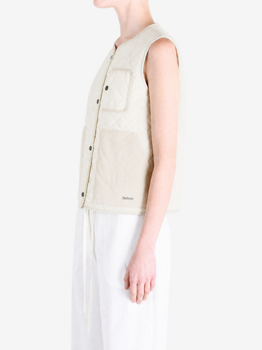 Tan top worn by a person, showing the top fit